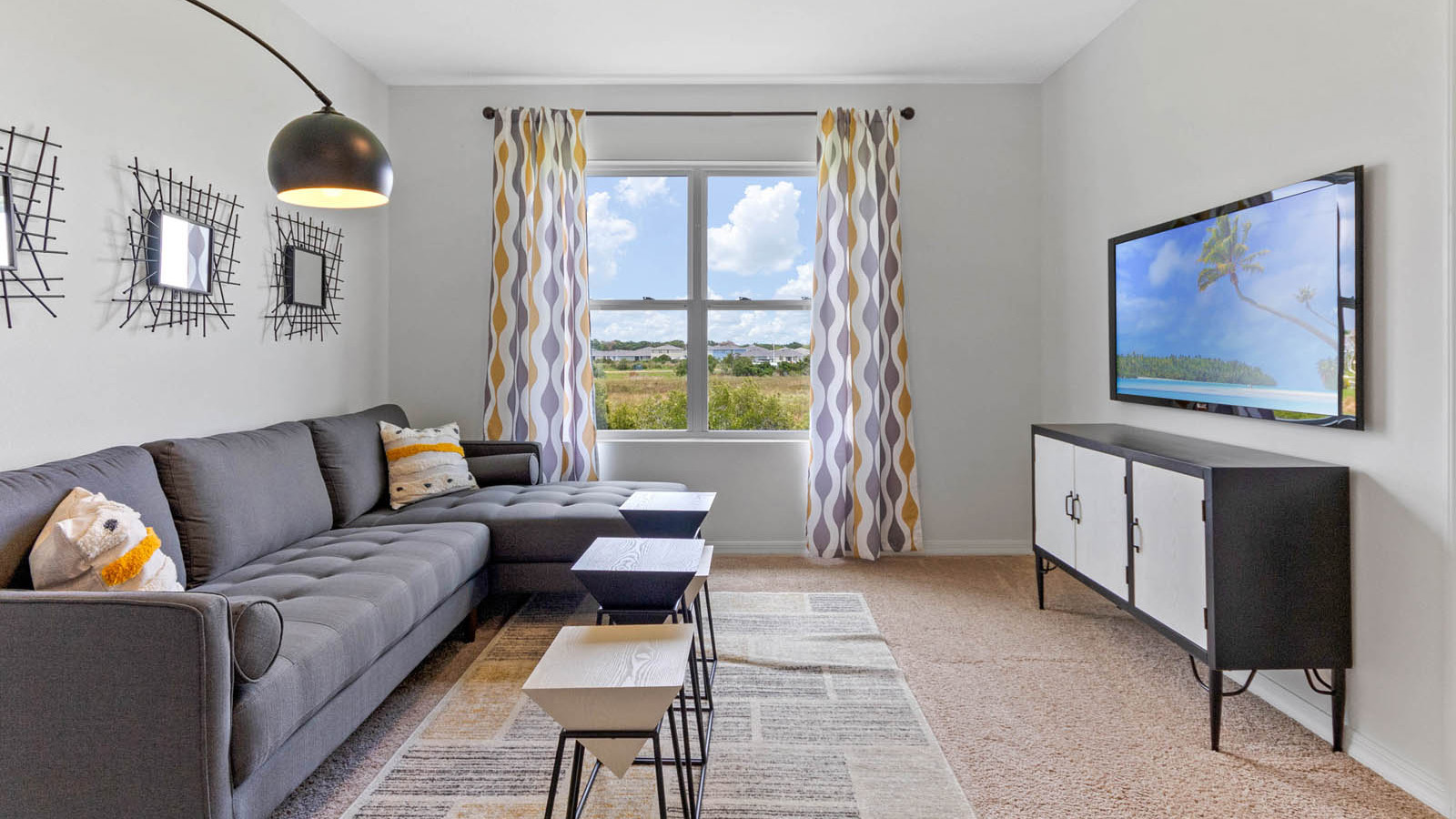 Upstairs loft area with couch and tv