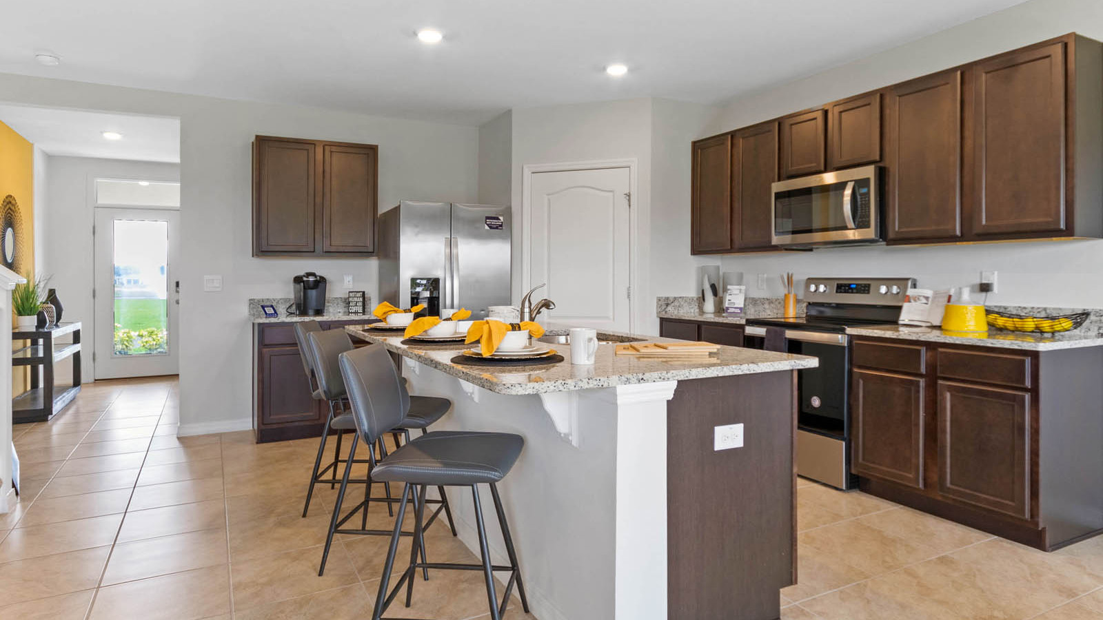 Kitchen with island and view of the entryway