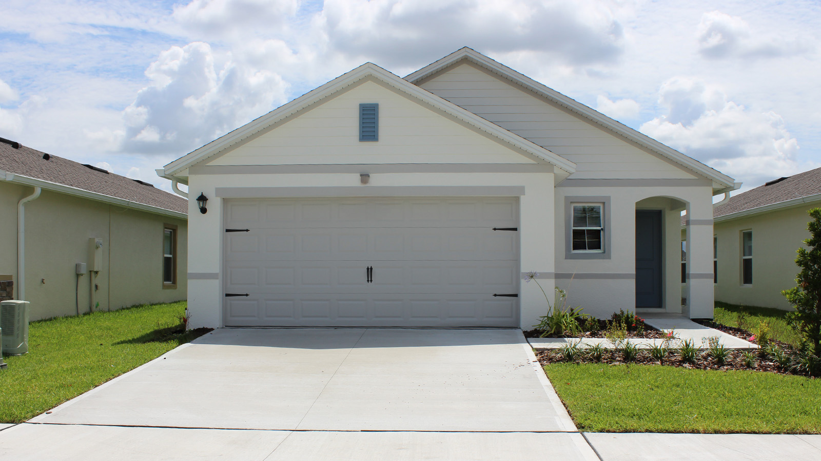 Exterior single family home with two car garage