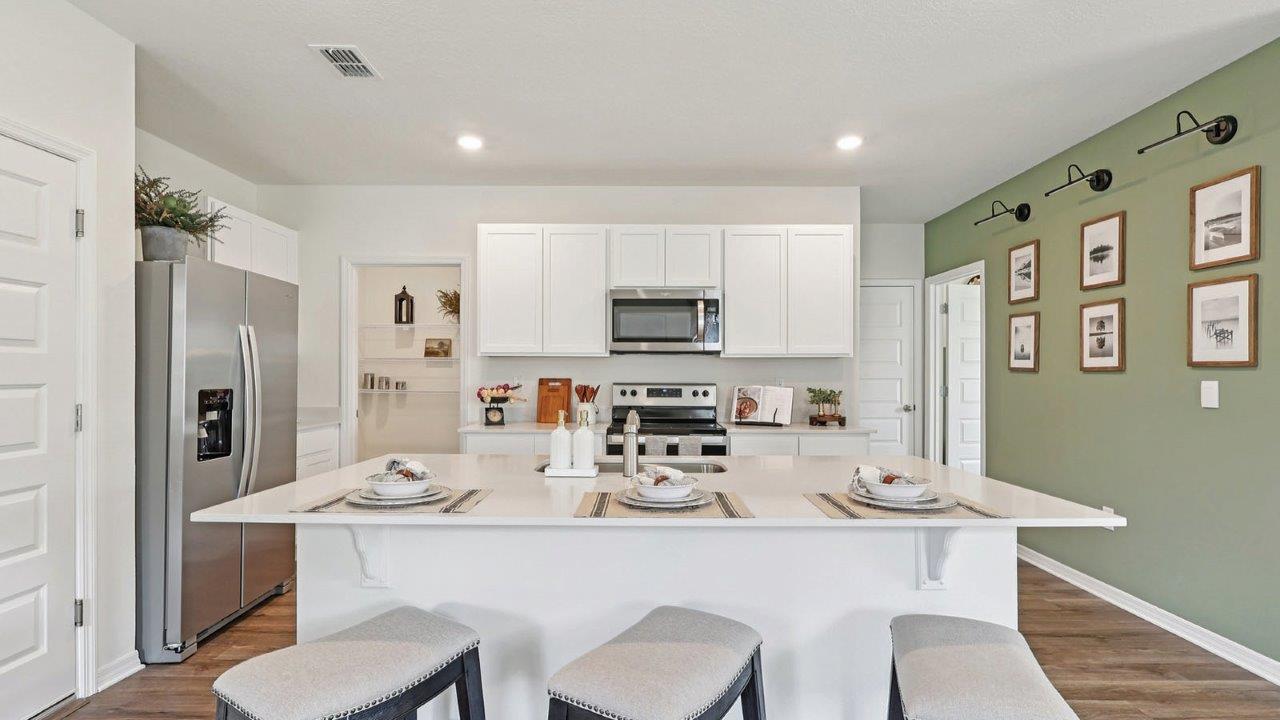 Kitchen with large island and bar stools
