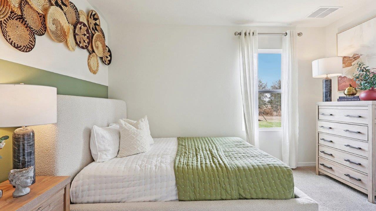 Guest bedroom with bed, nightstand and dresser