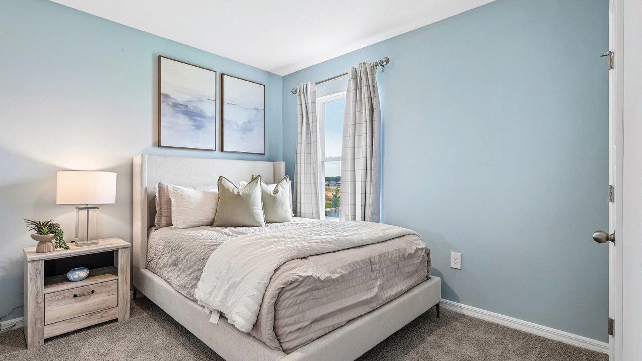 Guest bedroom with full size bed and nightstand