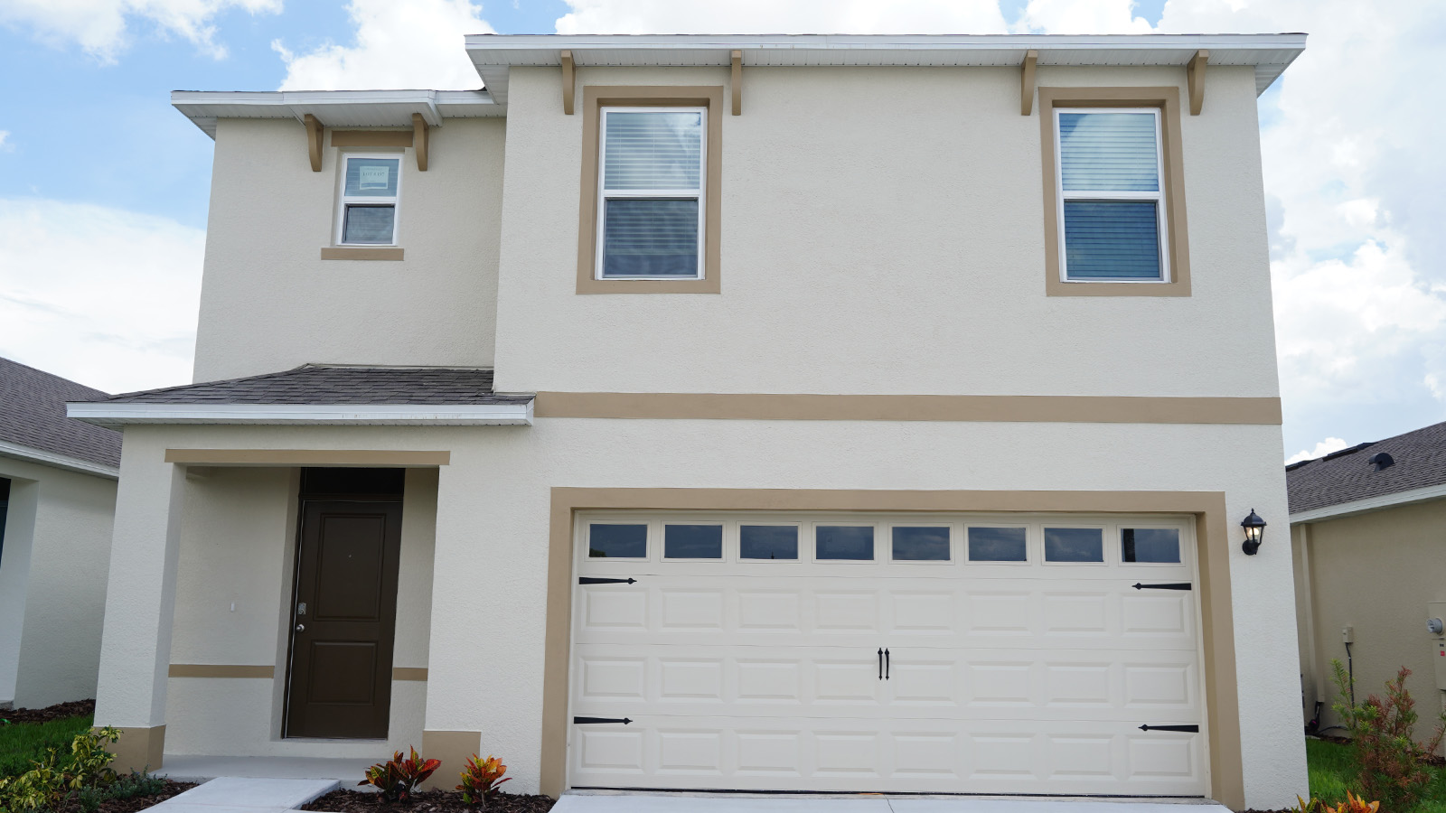 Exterior single family home with two car garage