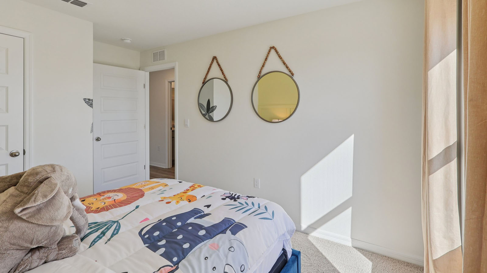 Guest bedroom with full size bed and young child decor