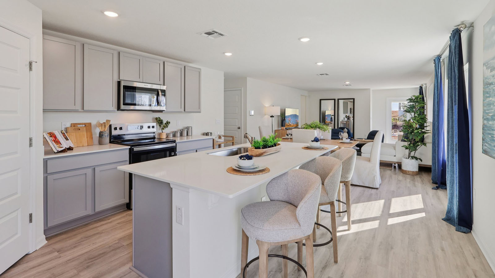 Kitchen with large island and grey cabinets