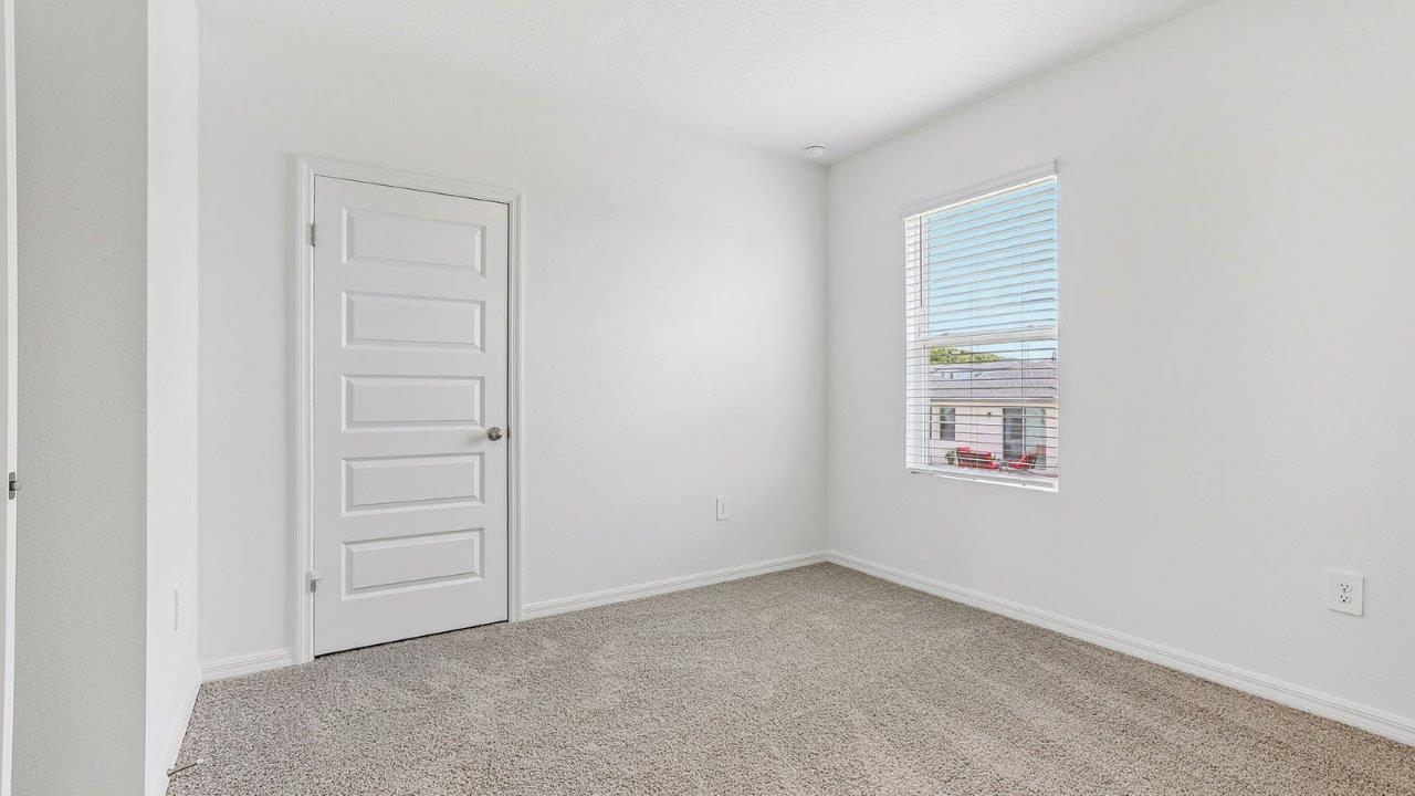Guest room with carpet and built in closet