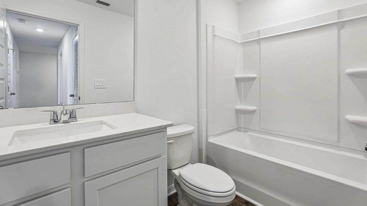 Upstairs guest bathroom with tub and shower combo