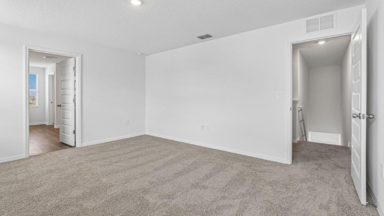 primary bedroom with carpet