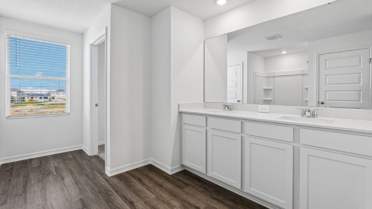 Primary bathroom with dual vanity sink