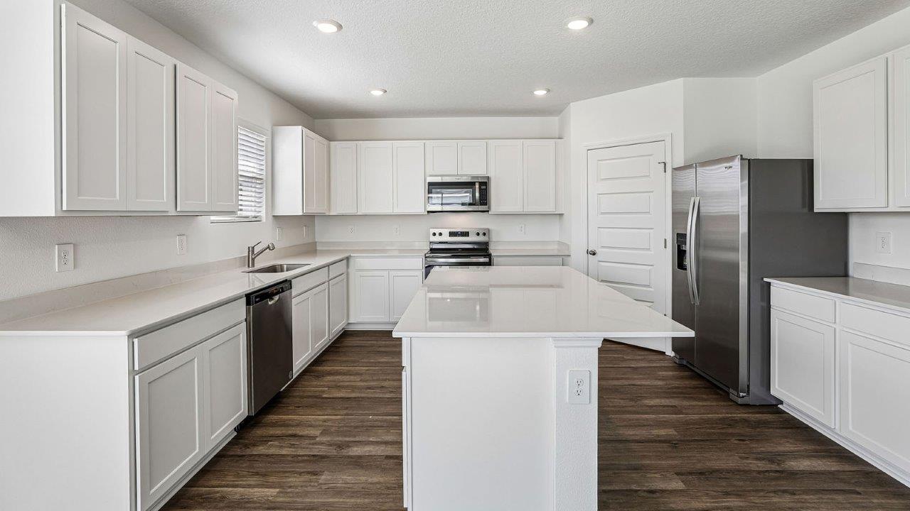 kitchen with island and quartz countertops
