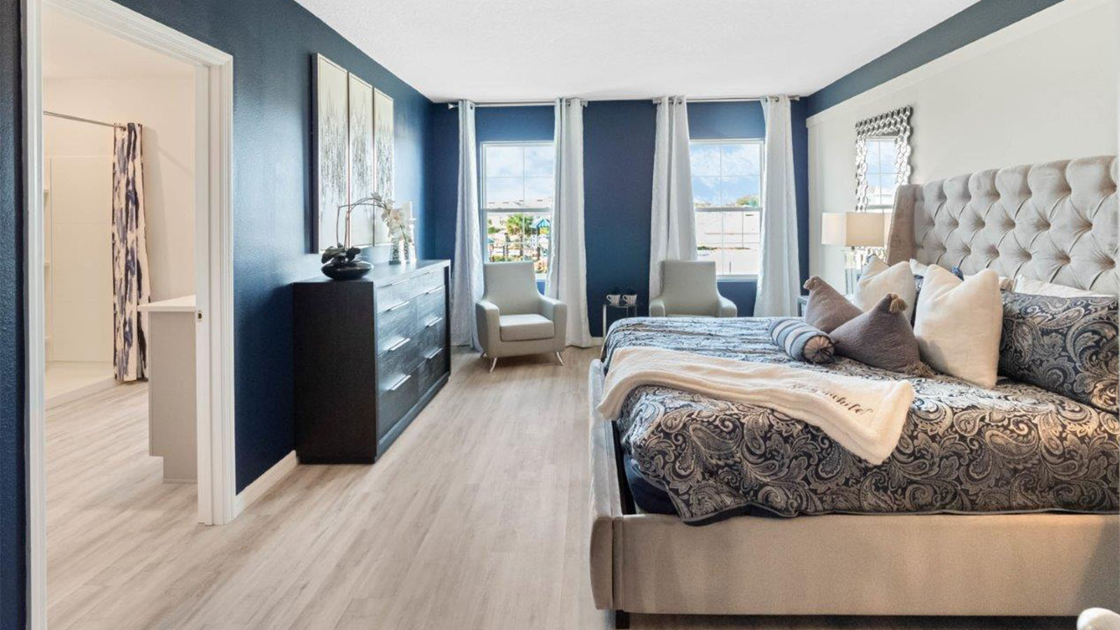 Spacious primary bedroom with attached bathroom
