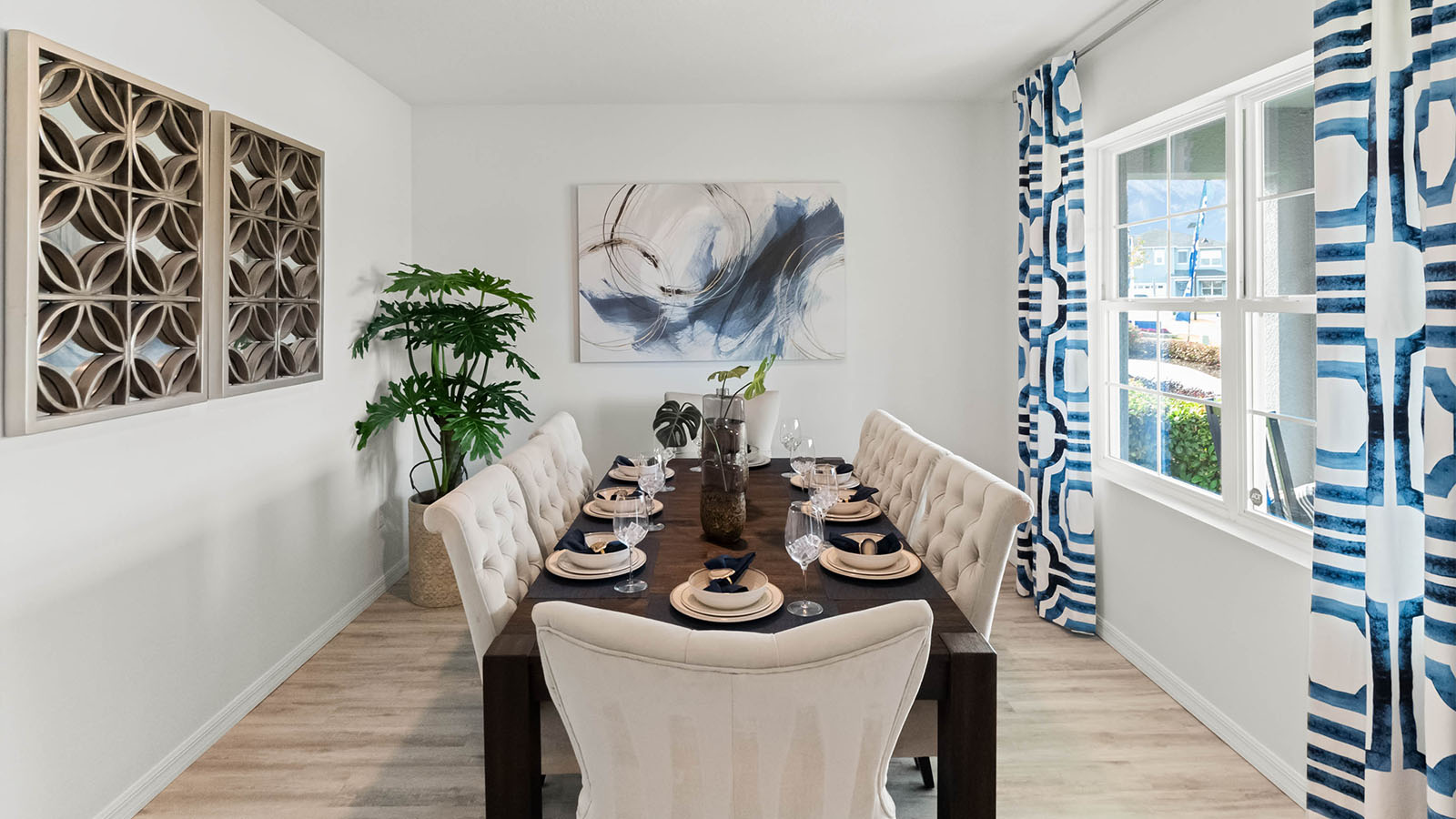Flex room with luxury vinyl plank and dining table