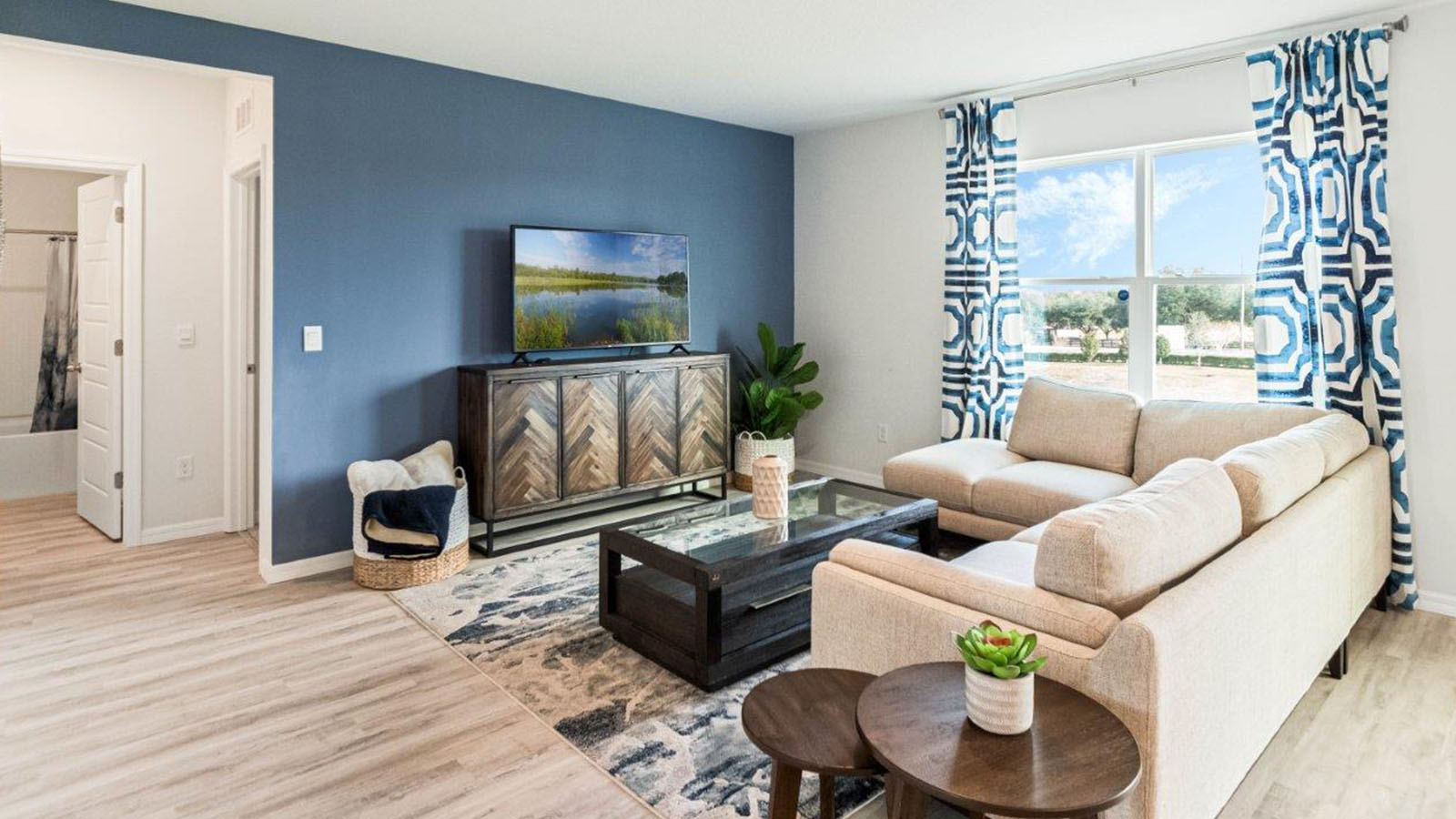 Spacious Living room with luxury vinyl plank and large sectional