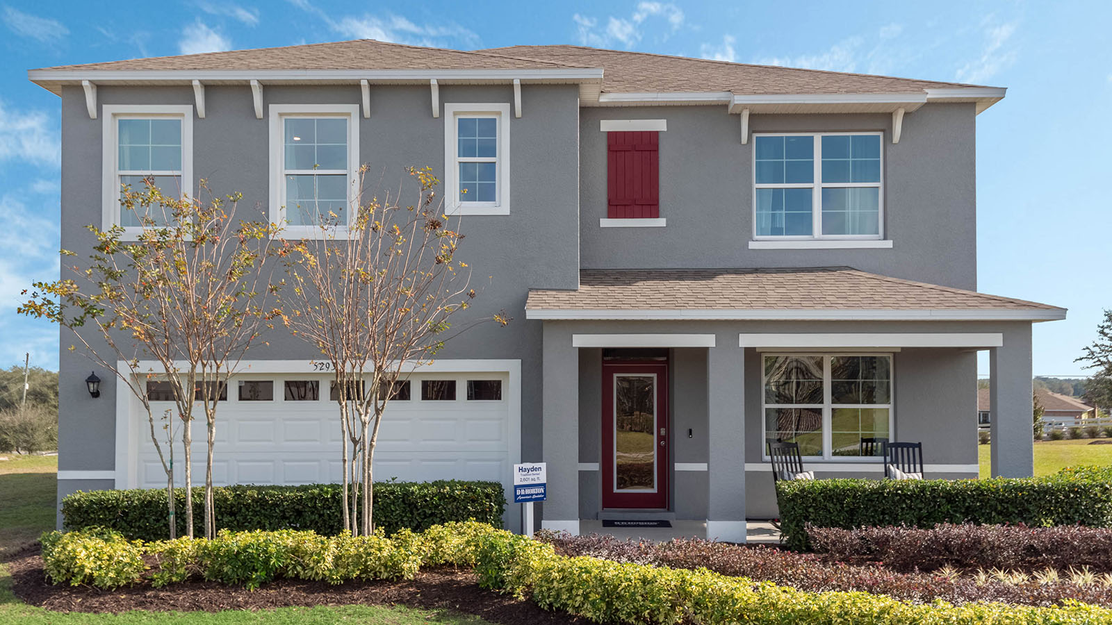 Two-story single-family home with front porch