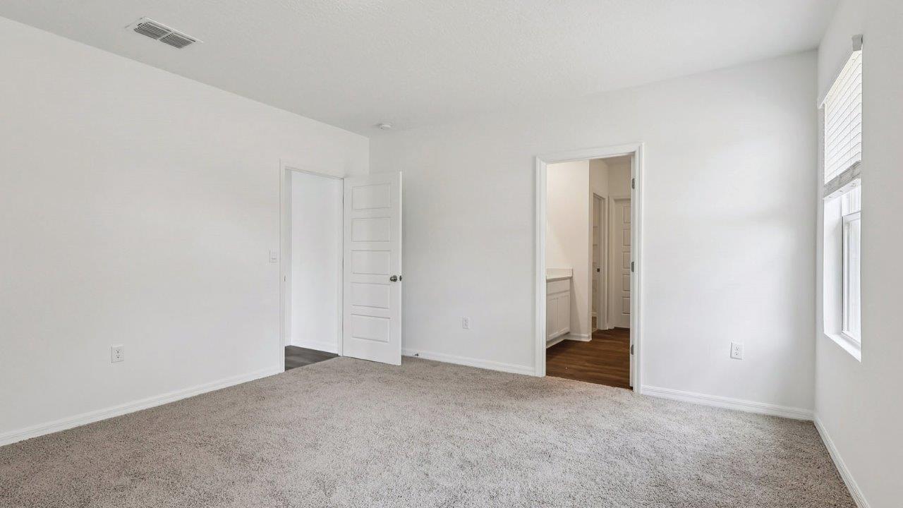 Primary bedroom with private bathroom