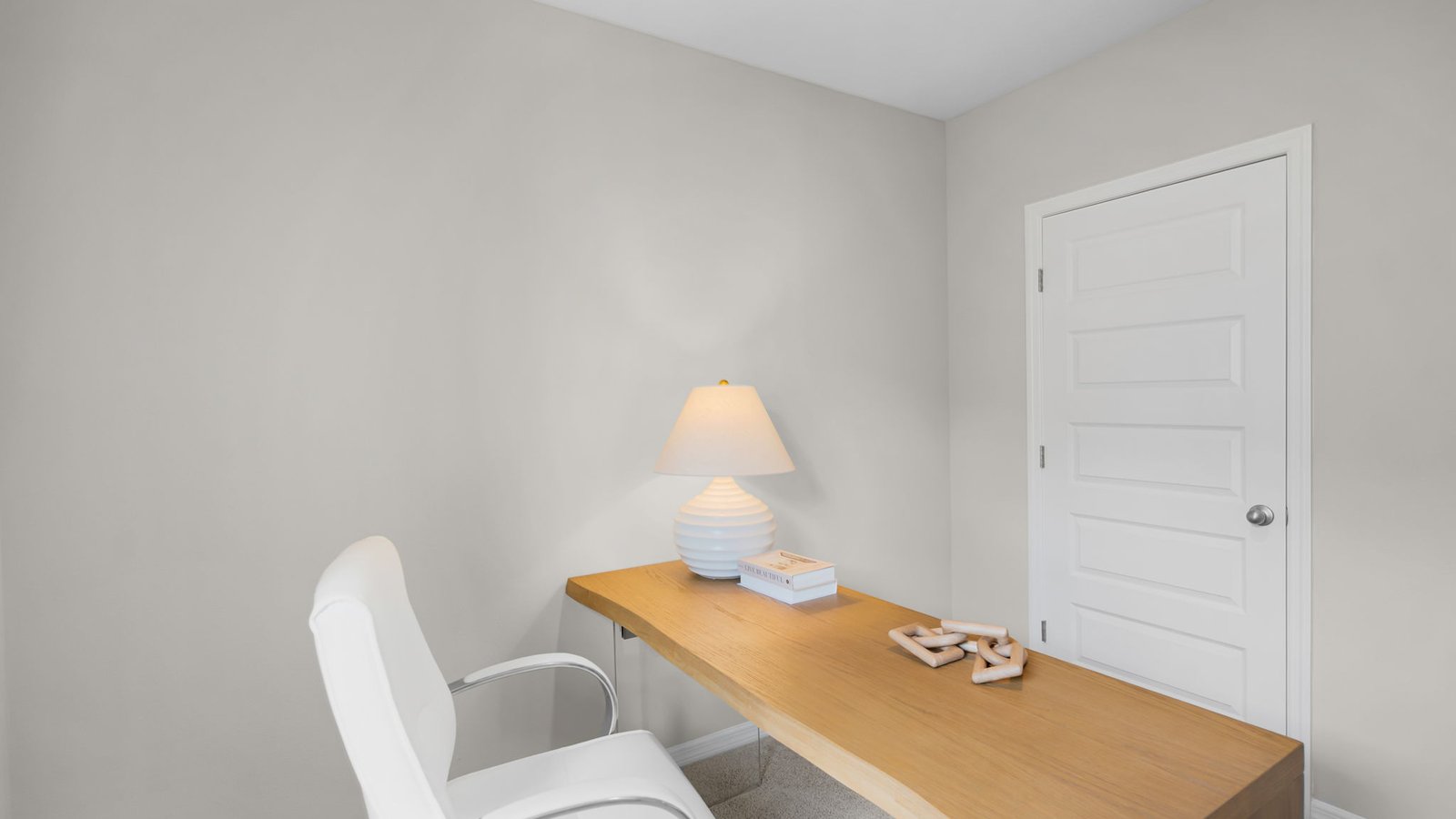 large desk in office with decor