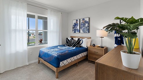Kids bedroom with carpet throughout