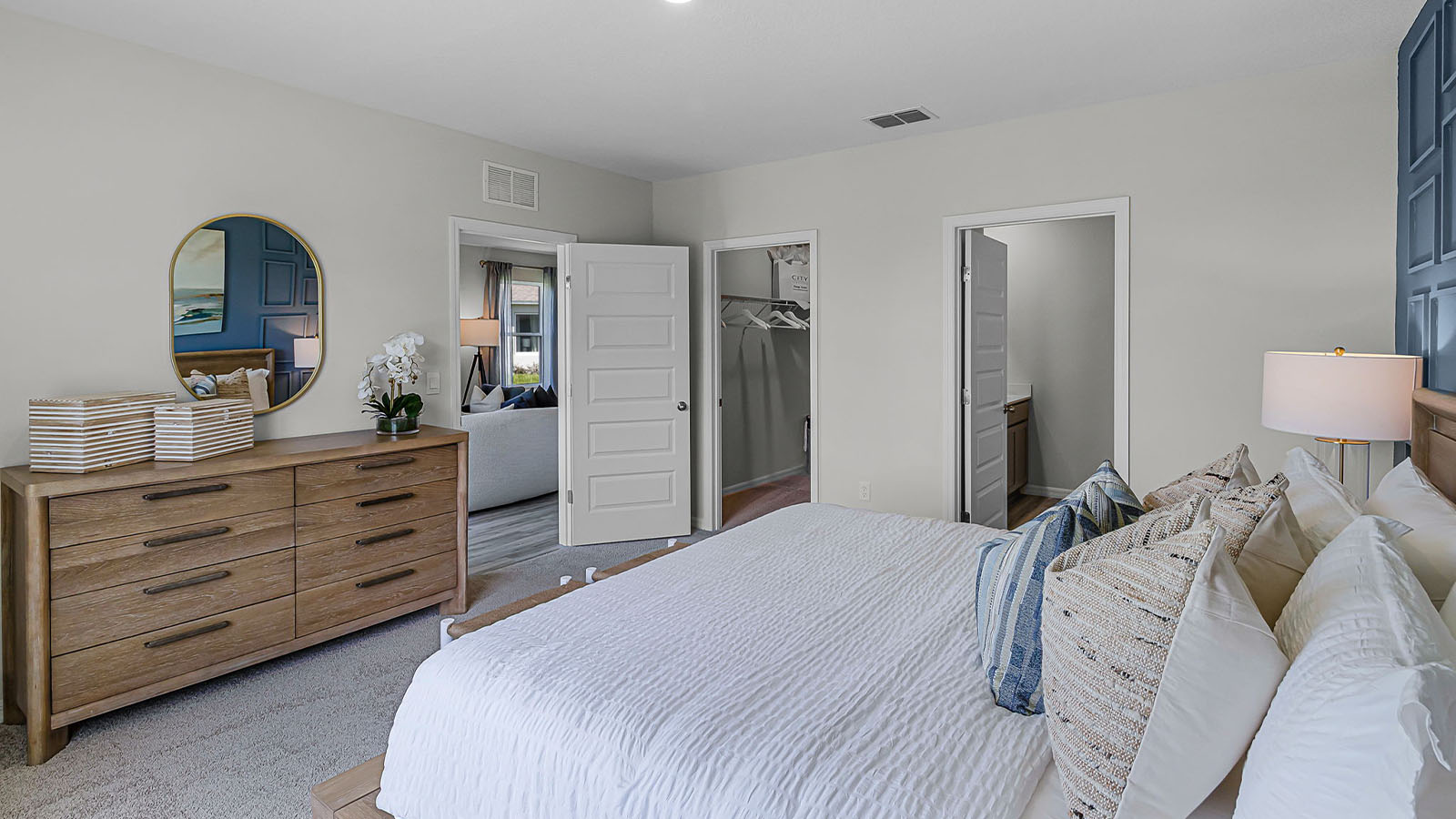 Primary bedroom showing door to bathroom