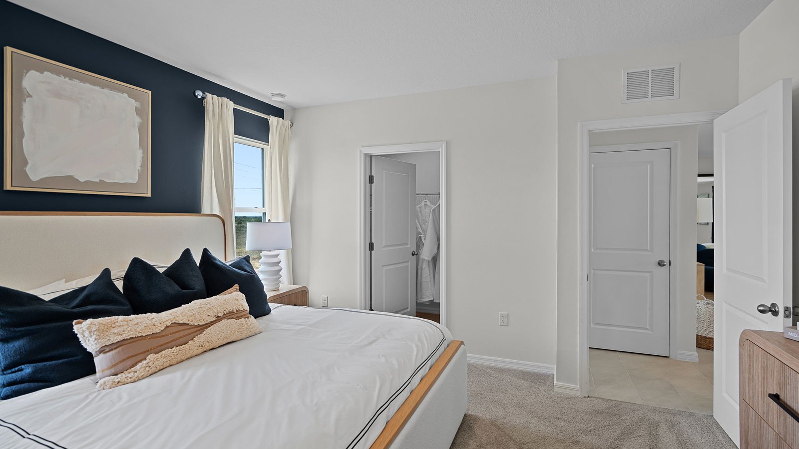 Primary bedroom with walk-in closet