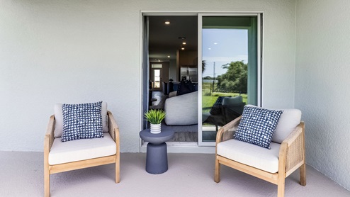 covered patio with lounge chairs