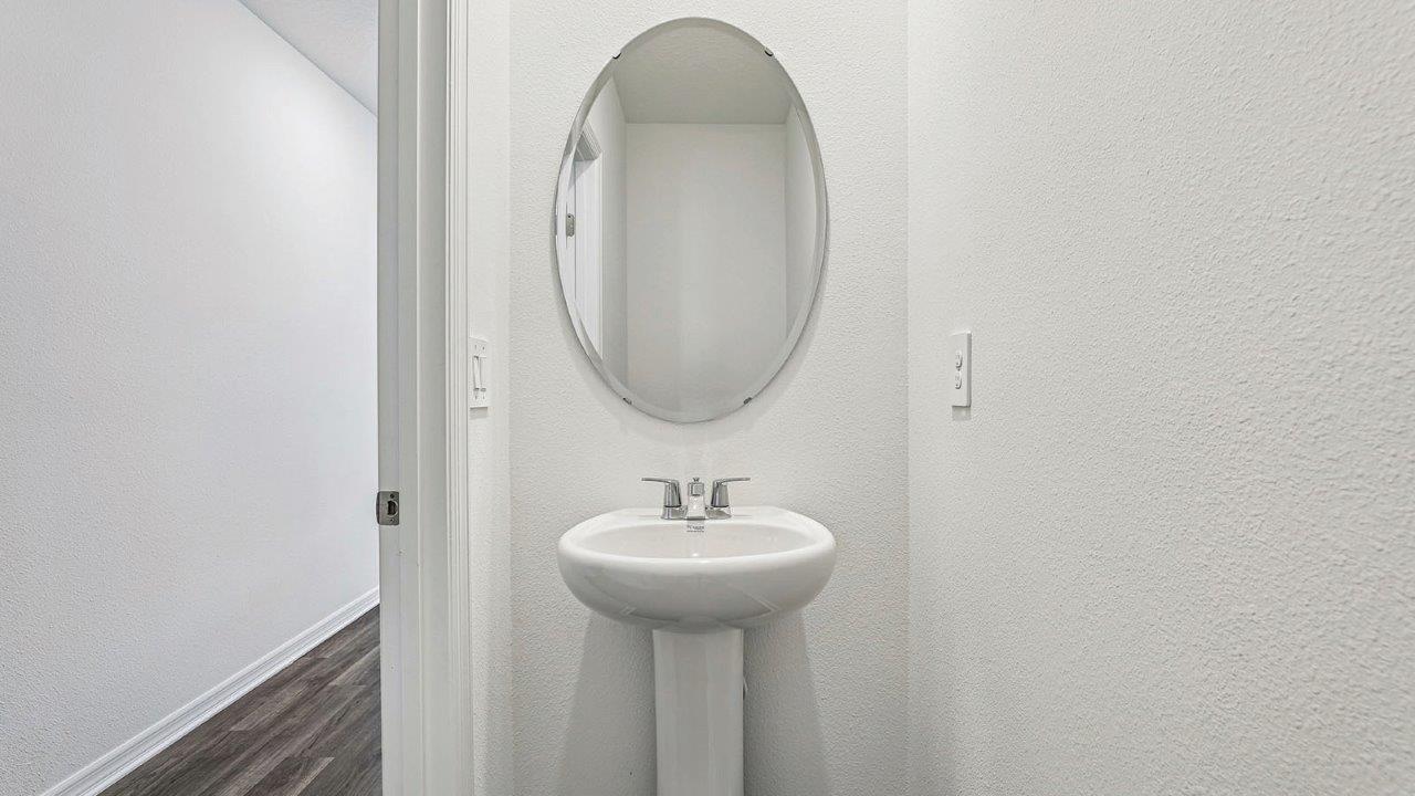 Downstairs powder room with pedestal sink