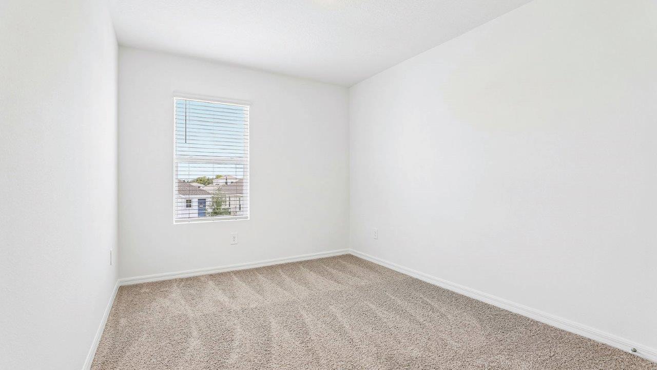 Bedroom 2 with carpet flooring