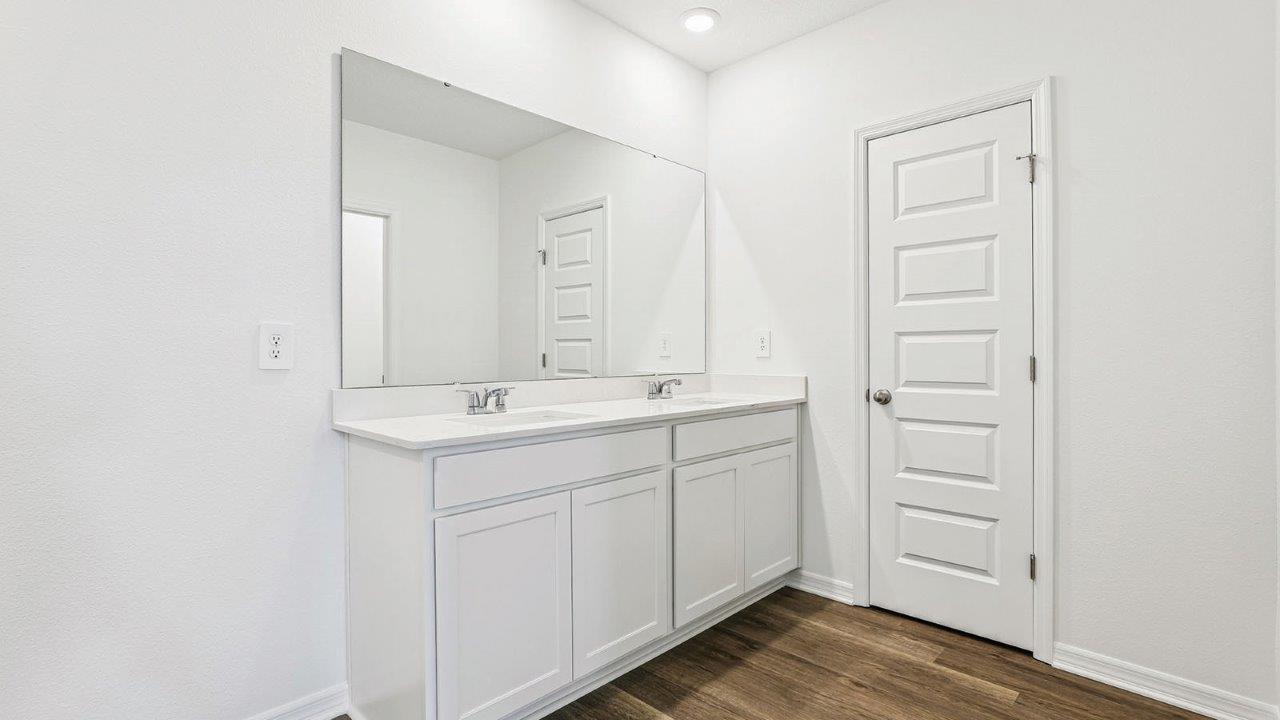 Primary bathroom with dual vanity sinks
