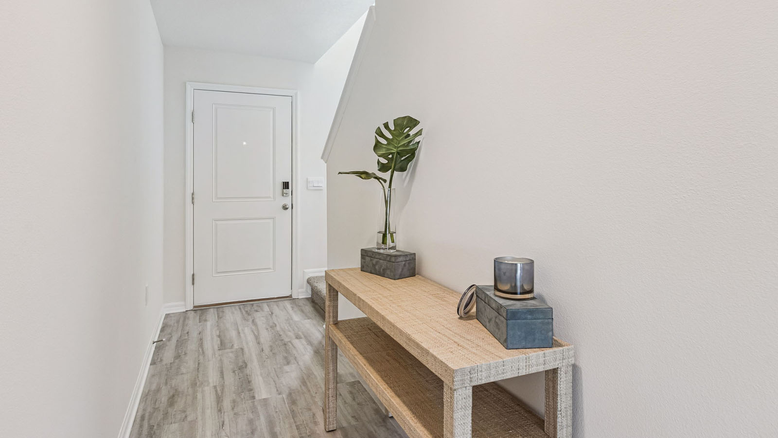 Entrance with half bathroom and stairs to second floor