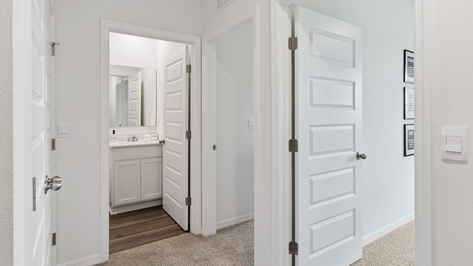 Upstairs hallway to guest bathroom and laundry closet