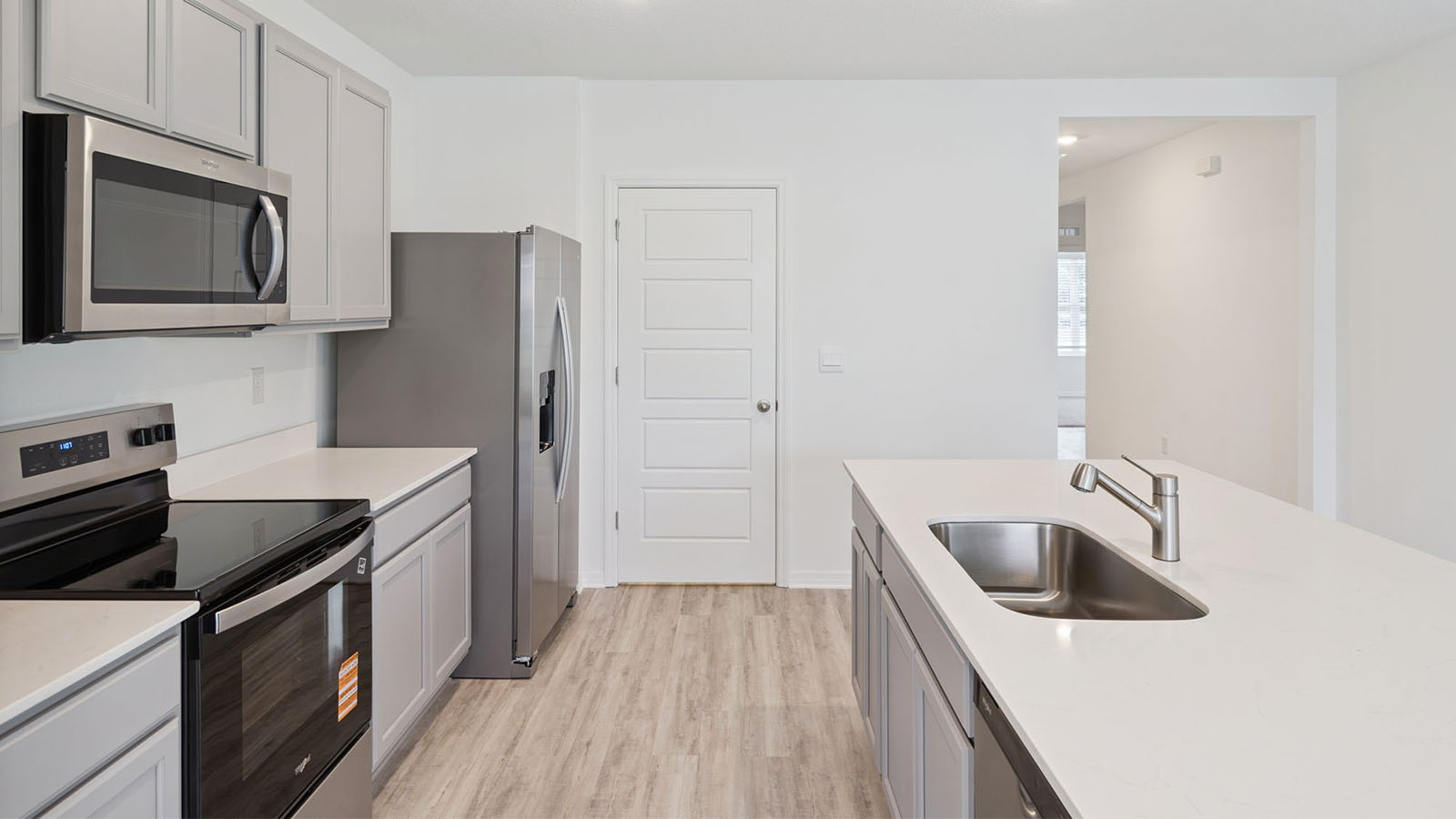 Kitchen with luxury vinyl plank and large pantry