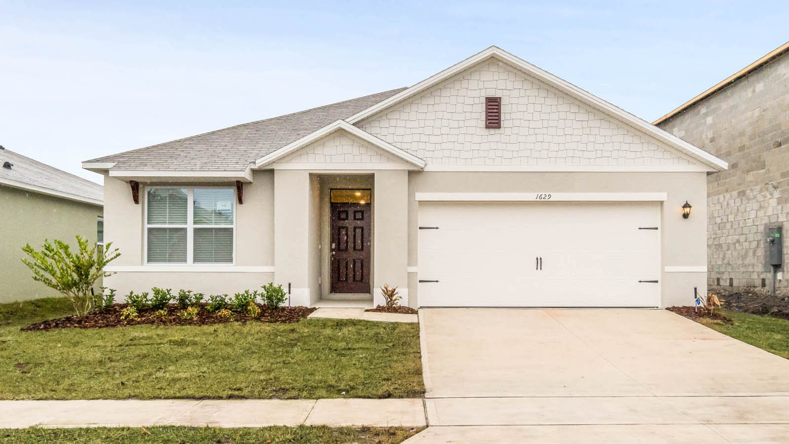 Exterior single family home with two car garage