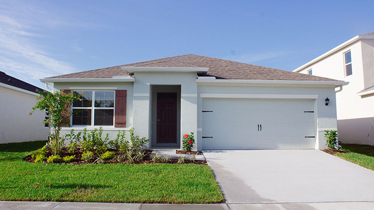 Exterior single family home with two car garage
