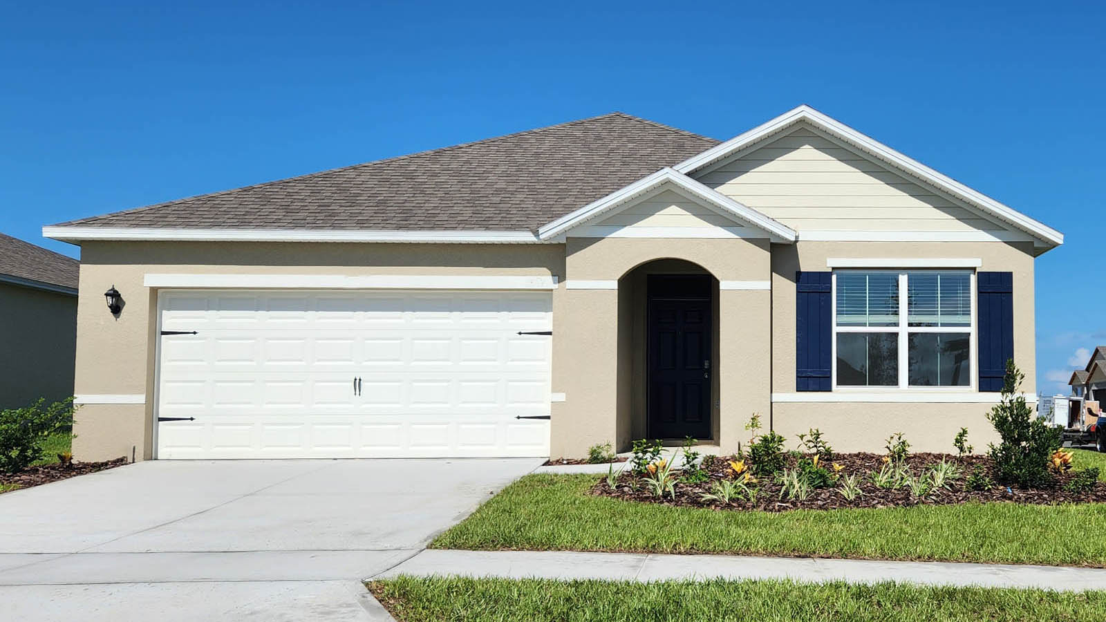 Exterior single family home with two car garage