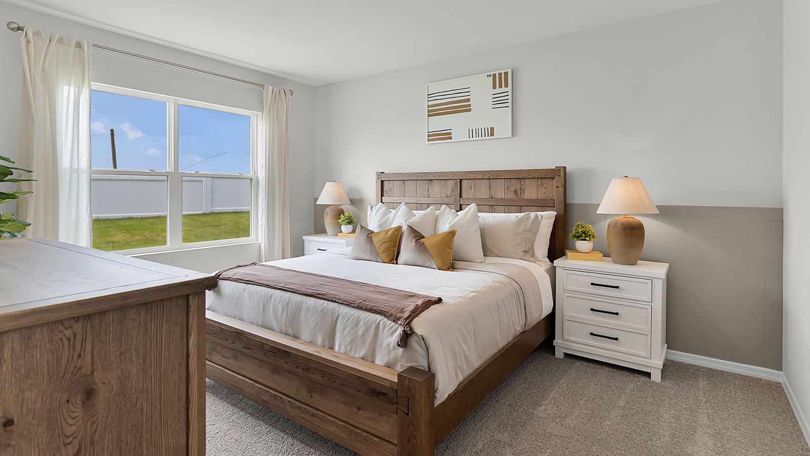 Primary bedroom with king bed night stands