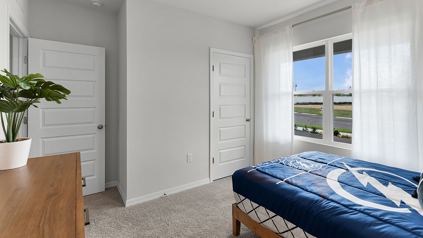 Kids bedroom with carpet throughout