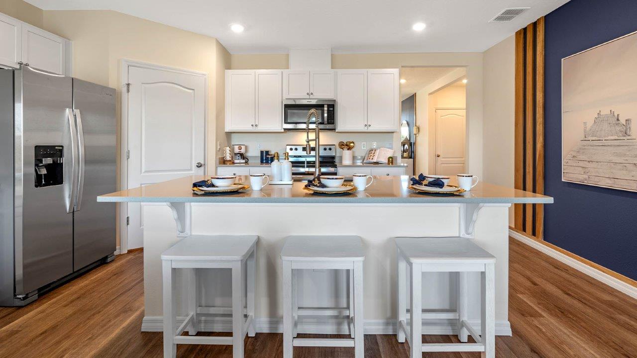 kitchen with large island and barstools