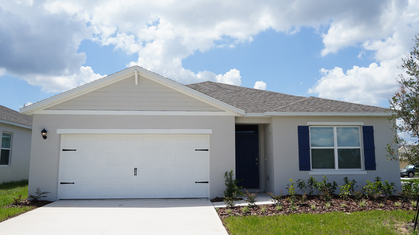 Exterior single family home with two car garage