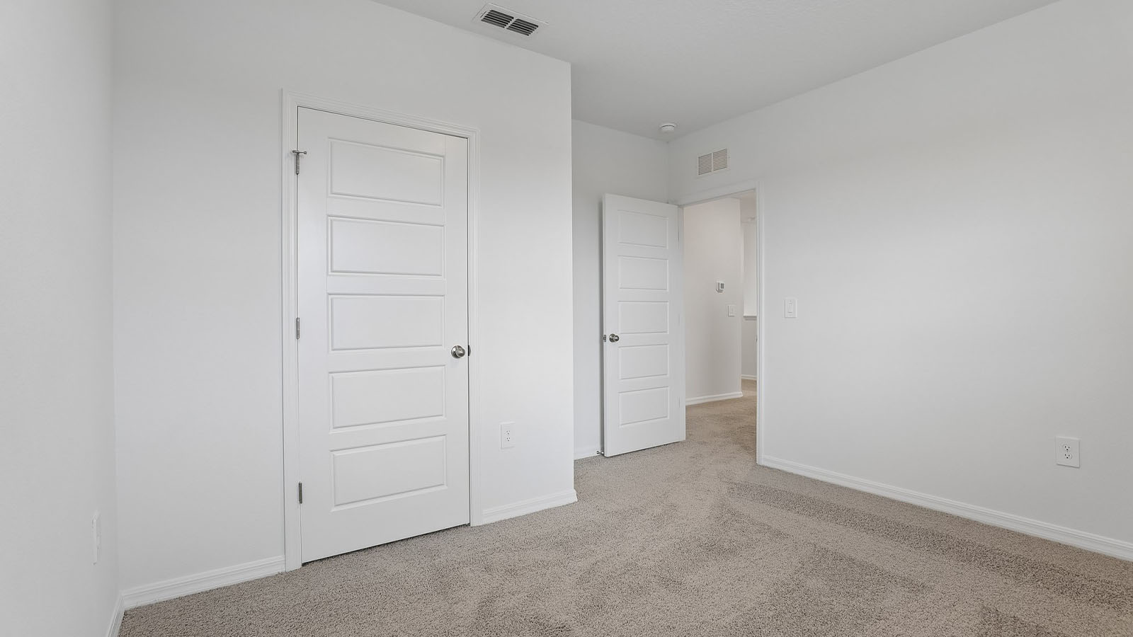 Primary bedroom with private bathroom and walk in closet