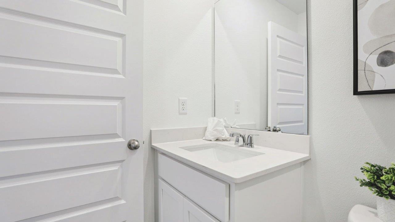 Guest bathroom with tub and single vanity sink