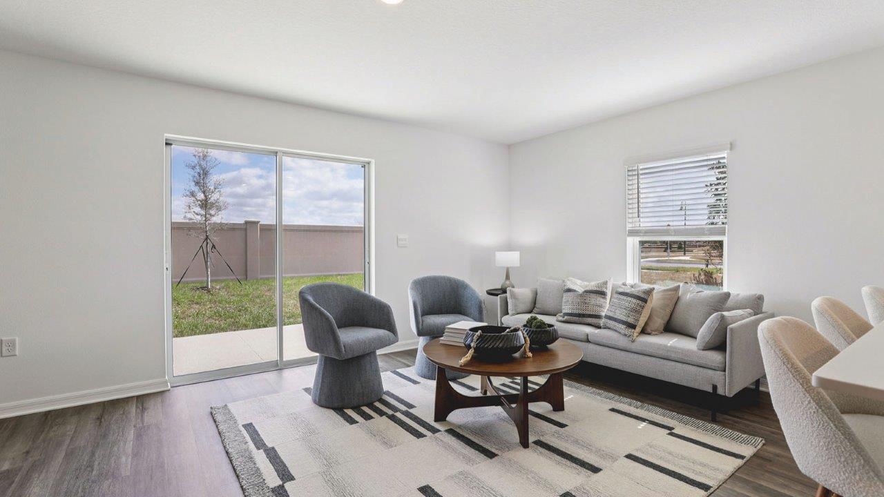 Living room with sectional couch and patio doors