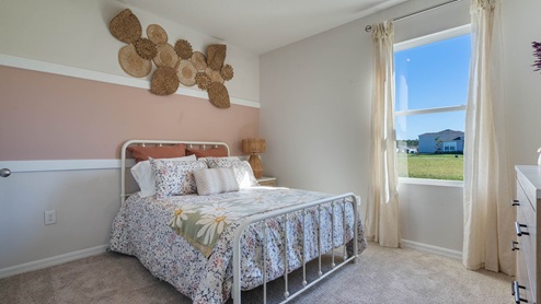 Guest bedroom with carpet throughout the bedroom