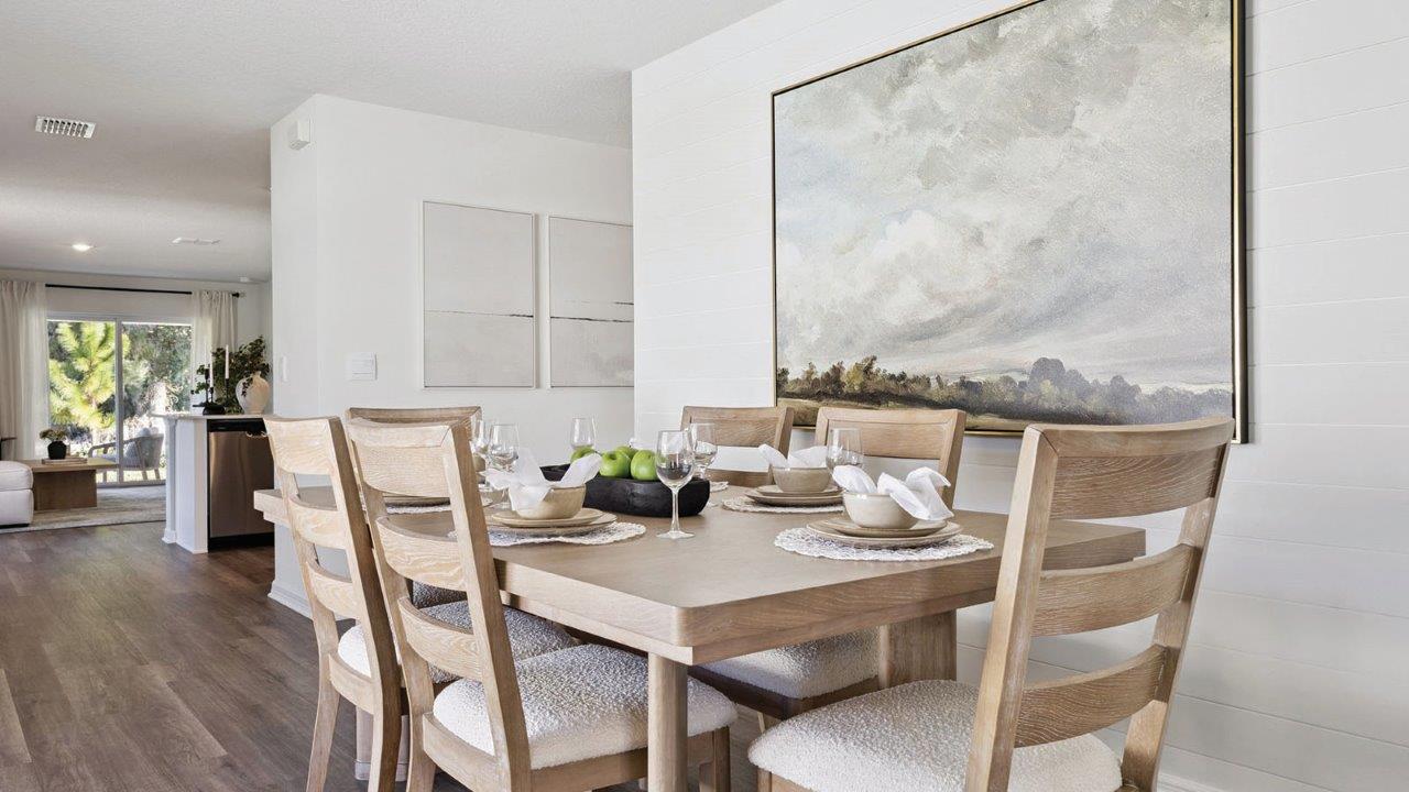 dining room with 6 person table and art