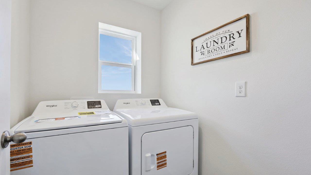 Laundry room with washer and dryer