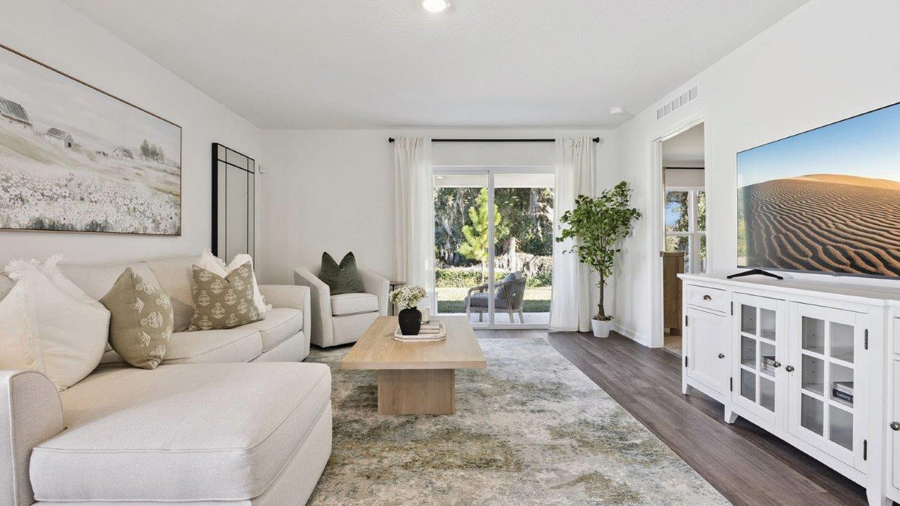 Living room with sliding glass door to the backyard