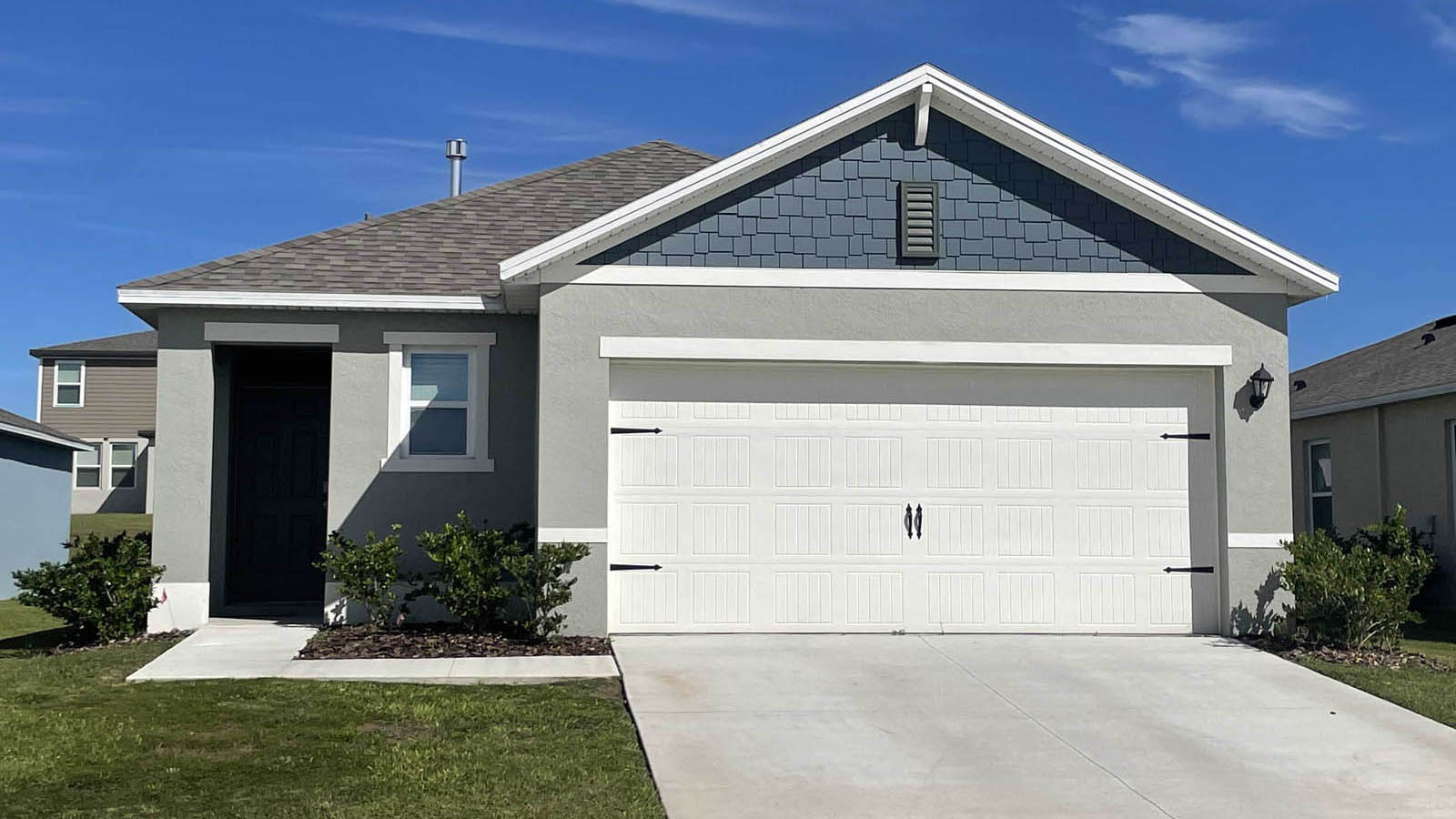 Exterior single family home with two car garage