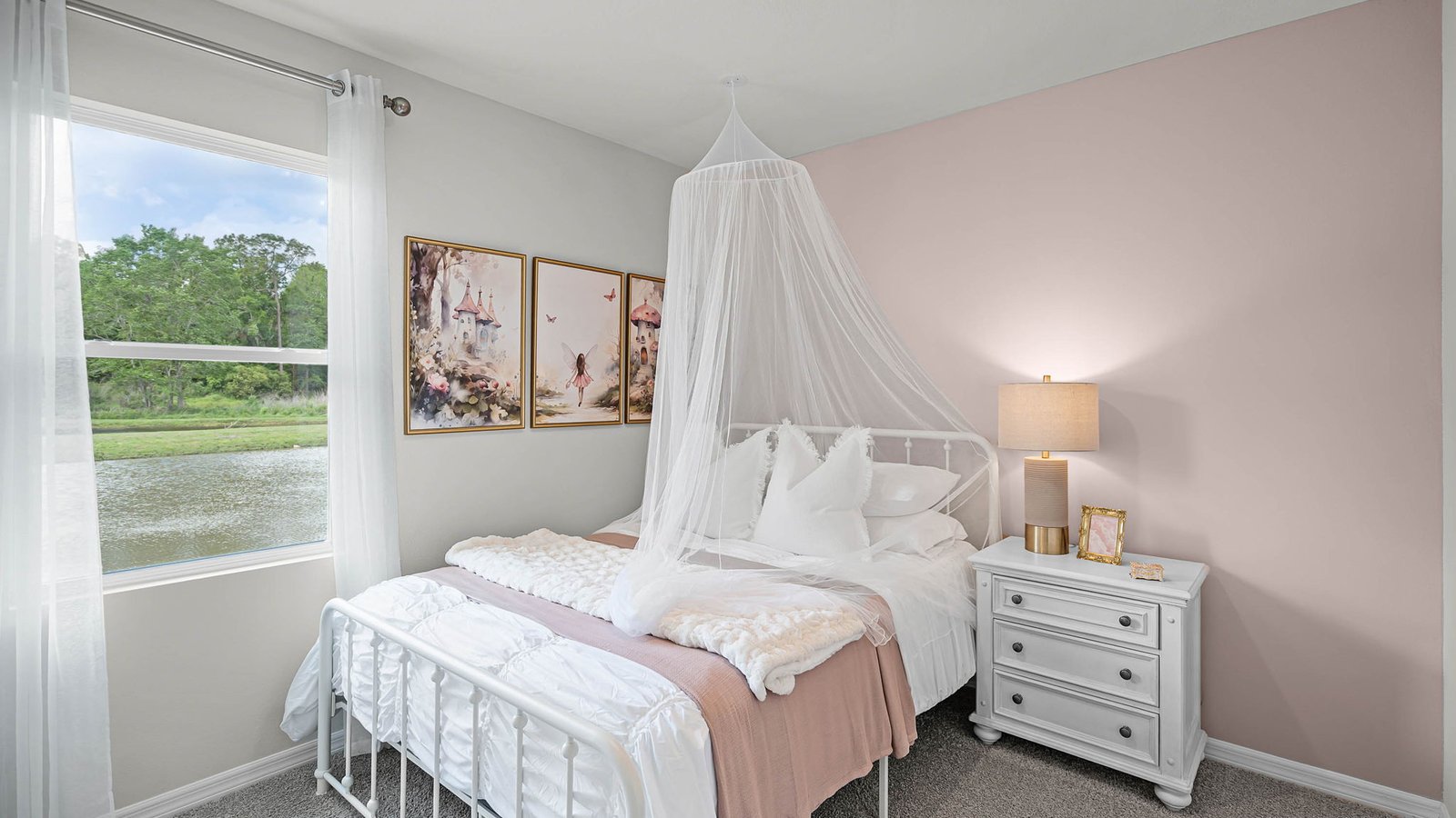 guest bedroom with full bed and vanity