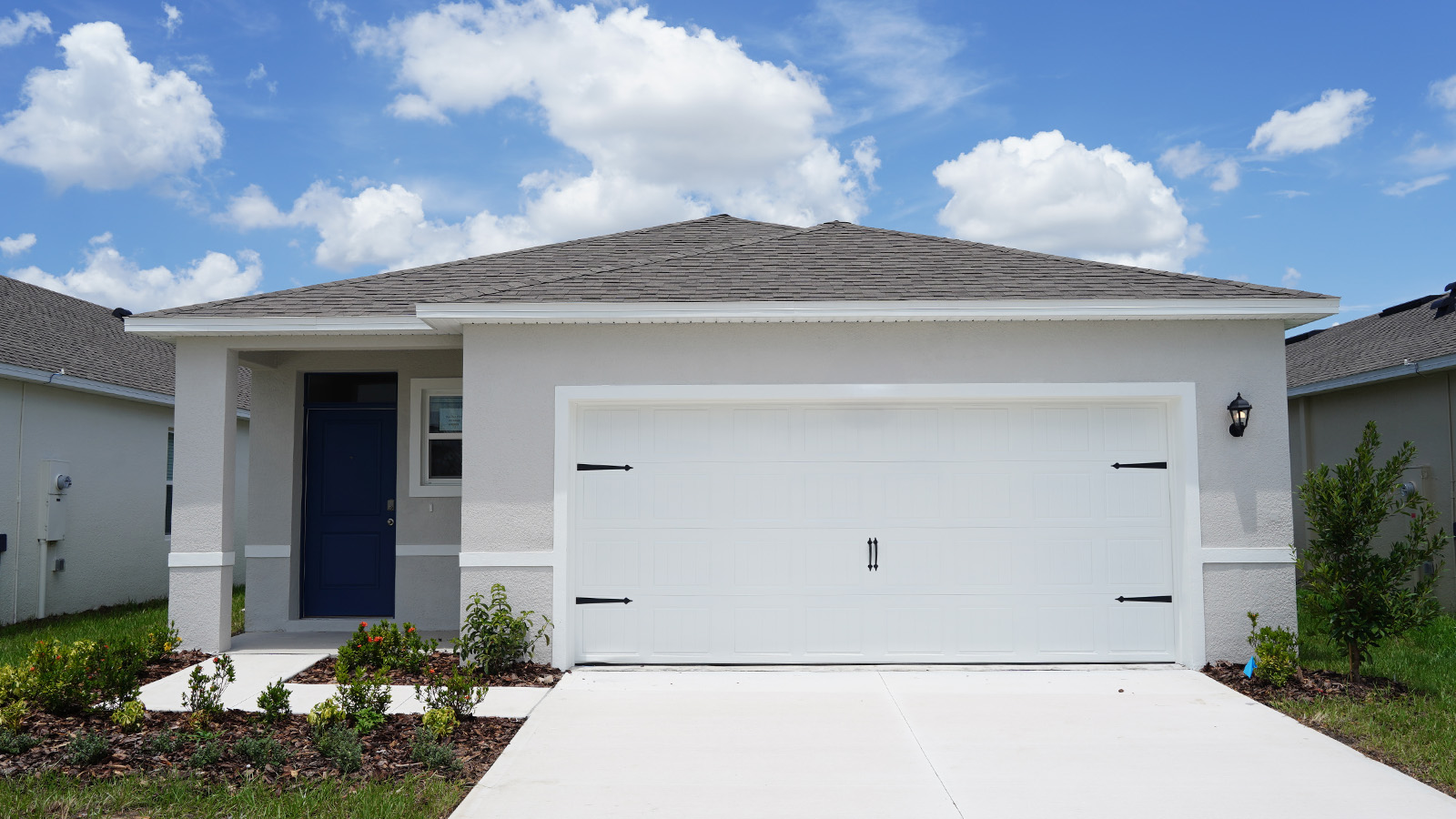 Exterior single family home with two car garage