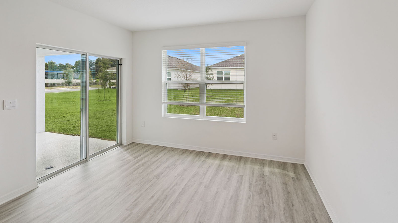 Dining Room with sliding glass door to rear covered patio