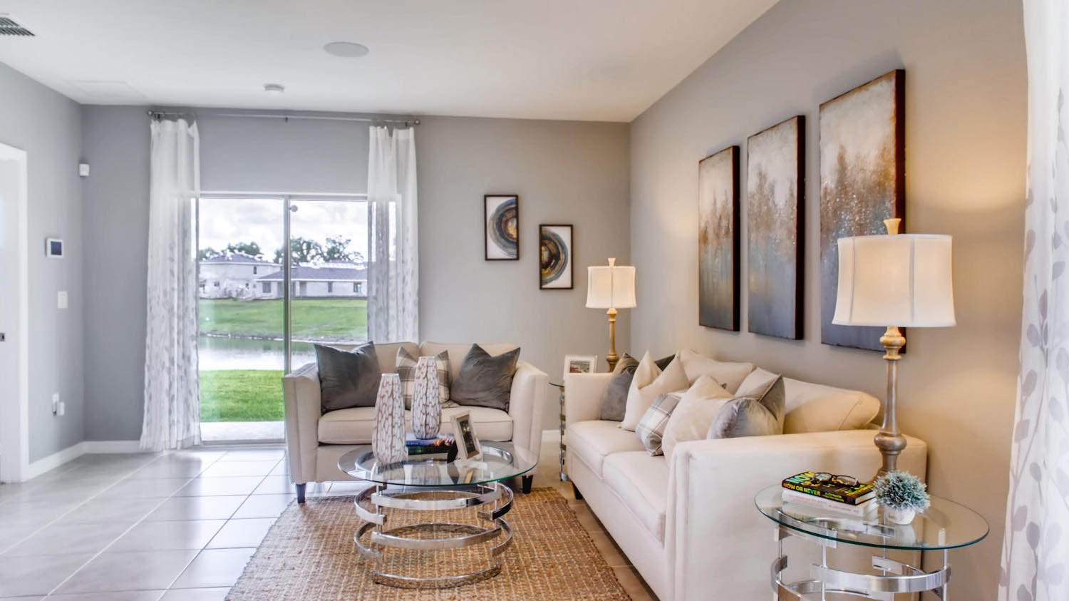 Living room area with a couch and ottoman