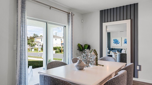 Dining room table to the right of the sliding glass door